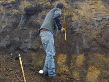 Collecting samples during the construction
of a water reservoir while enduring pouring rain.